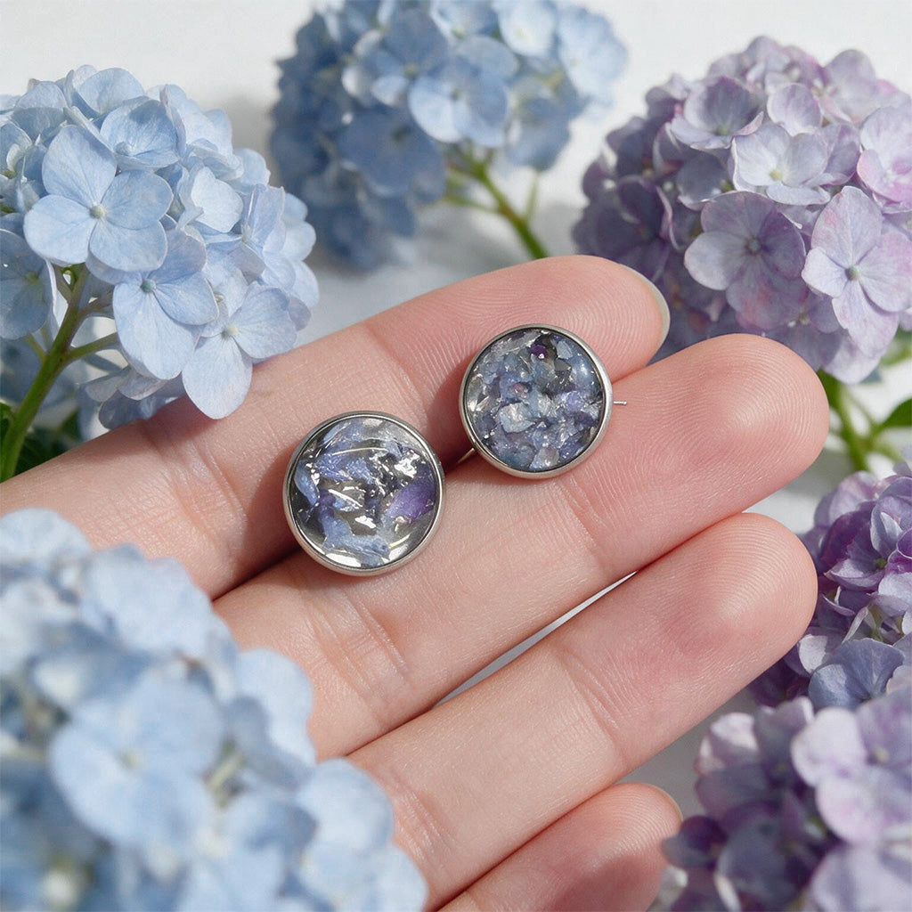 Hydrangea stud earrings with real hydrangea flowers preserved in resin, handcrafted in Finland with stainless steel posts.
