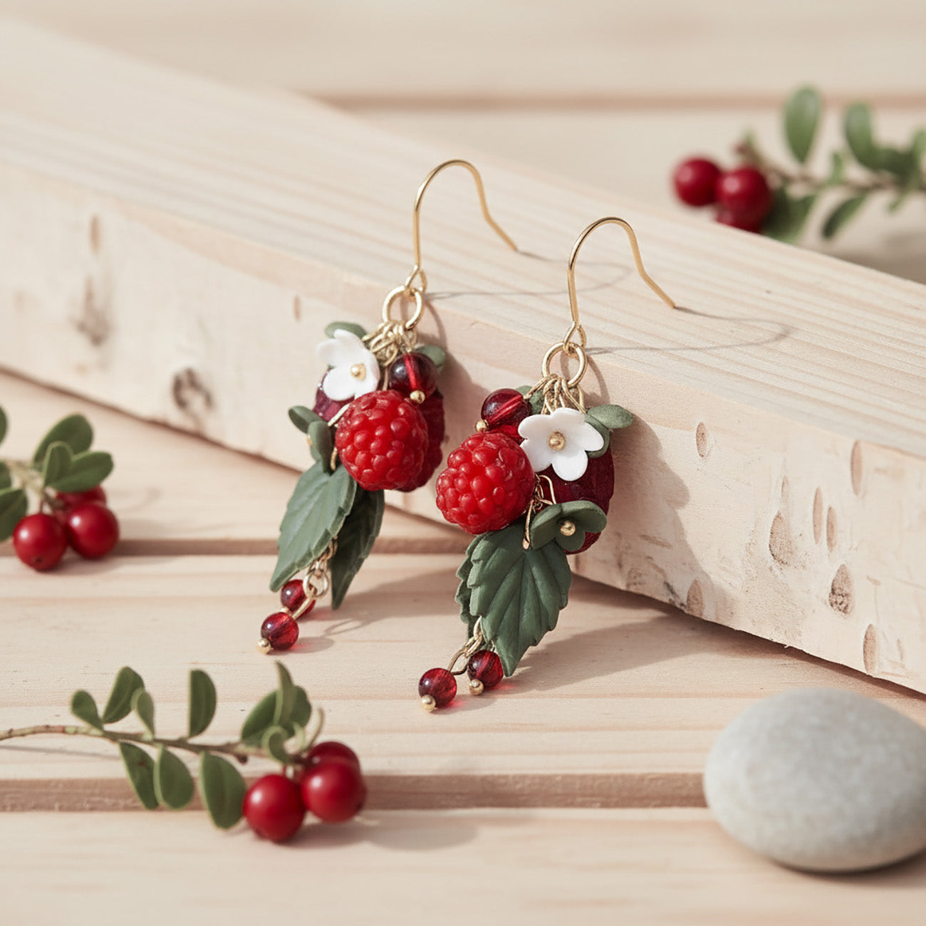 Handmade raspberry cluster earrings with polymer clay berries, botanical details and 18K gold plated stainless steel hooks.