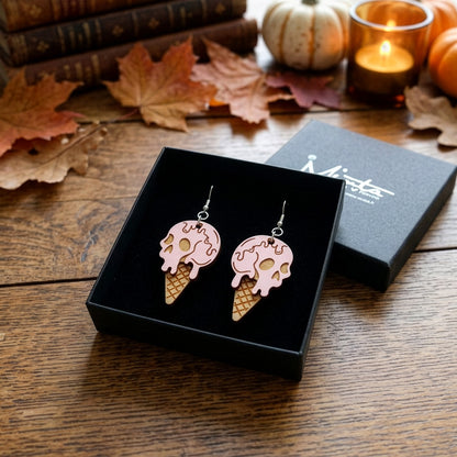 Halloween ice cream earrings in byMinta gift box with autumn leaves and candles.