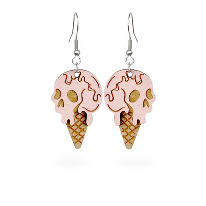 Halloween ice cream earrings on white background, handmade earrings from Finnish birch plywood.