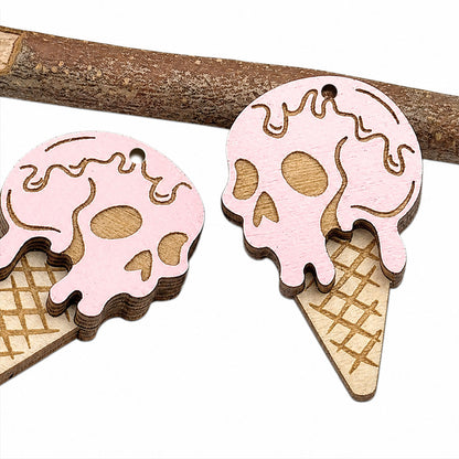 Close-up of Halloween ice cream skull earrings