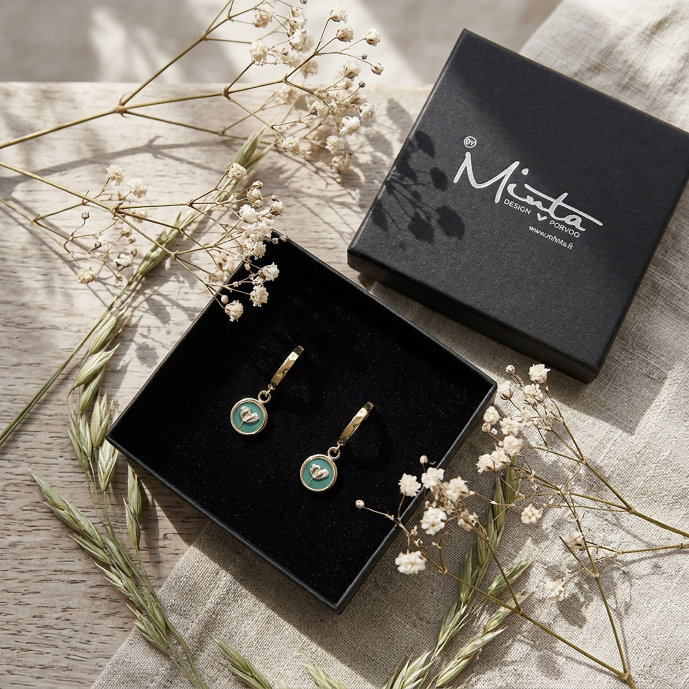 Sage green flower huggie earrings in byMinta gift box with dried flowers and soft natural styling