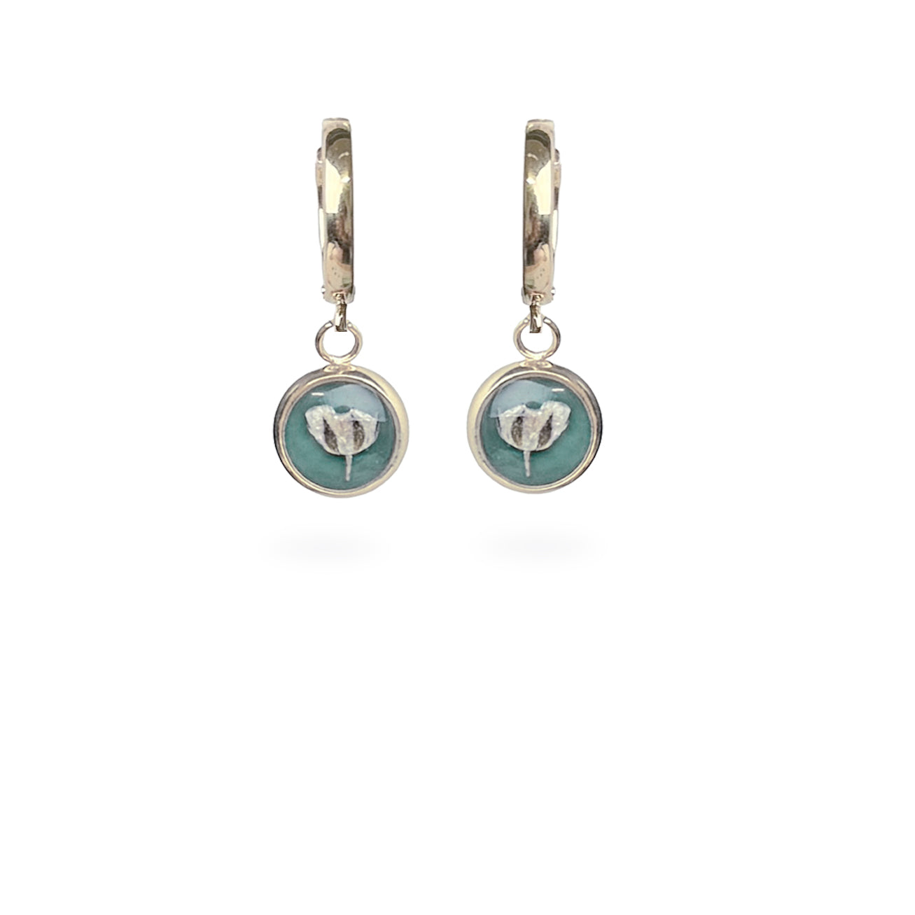 Delicate botanical huggie earrings with real white flowers and soft sage green background, handmade in Finland