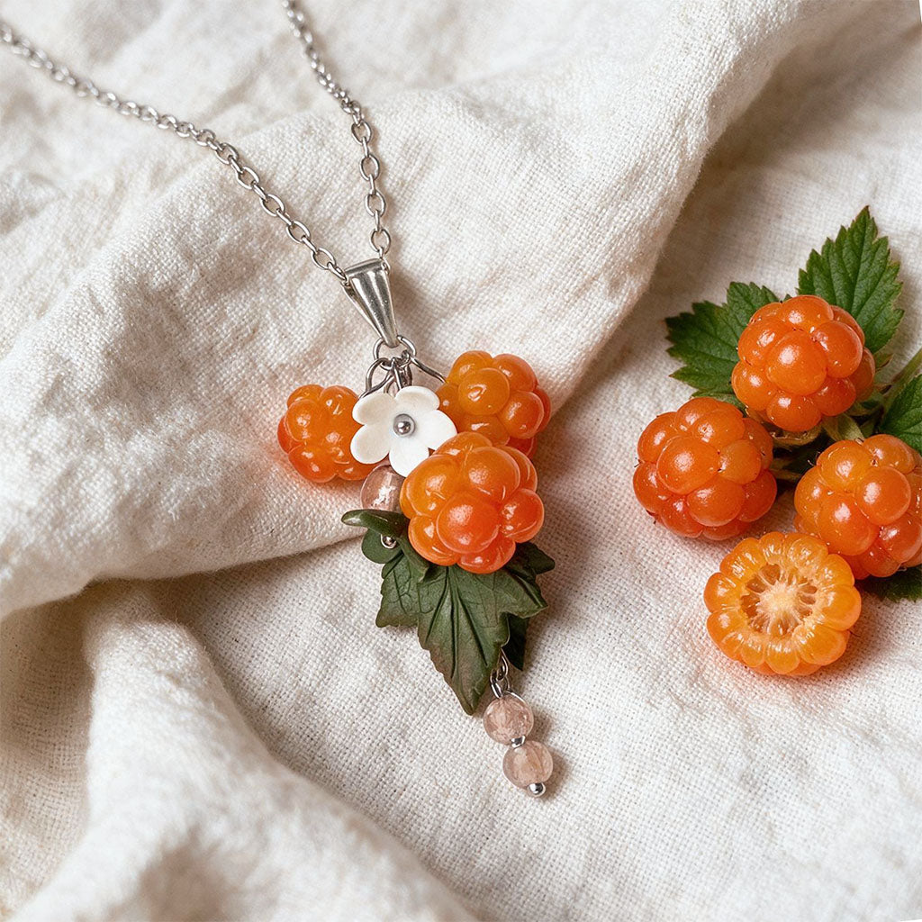 Cloudberry necklace with handmade orange berries, white flower and green leaves, stainless steel chain necklace, handcrafted Finnish jewelry.