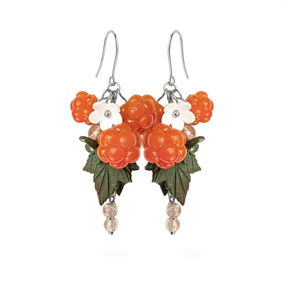 Cloudberry Marsh Earrings featuring hand-shaped cloudberries, white and green flowers, and green leaves. Handmade in Finland by byMinta.