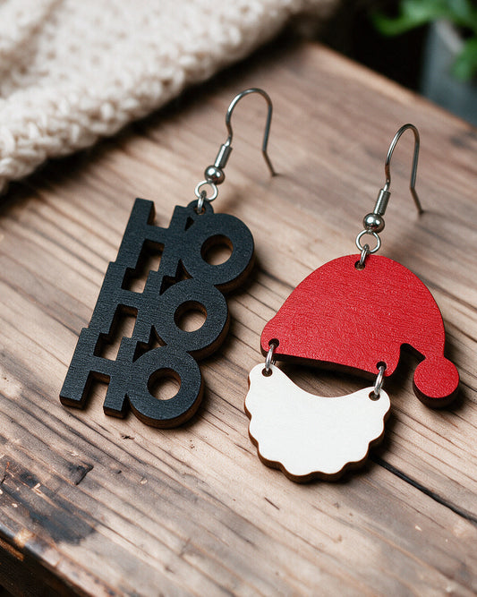 Ho Ho Ho Santa Claus earrings made in Finland, photographed on a wooden table in natural light