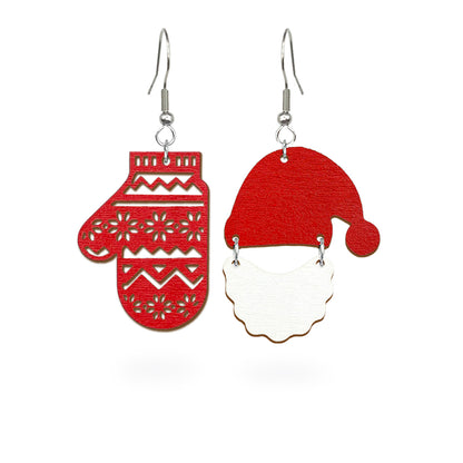 Playful Christmas earrings featuring a red mitten and Santa’s hat with beard, handmade from Finnish birch plywood and painted on both sides. Handmade in Finland by byMinta.