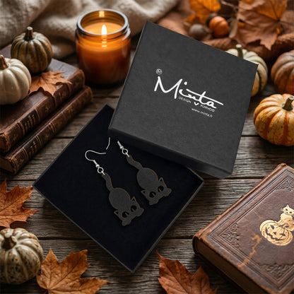 Black Cat Earrings in byMinta gift box with autumn leaves and Halloween decorations.