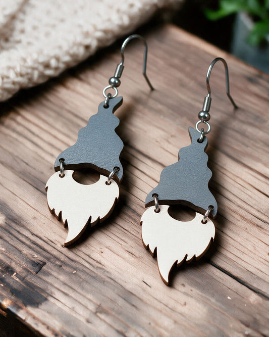 Christmas house elf earrings made in Finland, photographed on a wooden table in natural light