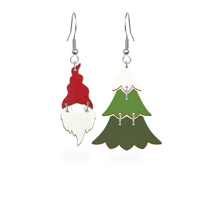 Playful mismatched earrings featuring a red gnome and a green Christmas tree, handmade from Finnish birch plywood and painted on both sides. Handmade in Finland by byMinta.