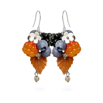 Berry Forest Earrings featuring hand-shaped cloudberries, blueberries, dark berries, and delicate white flowers. Handmade in Finland by byMinta.