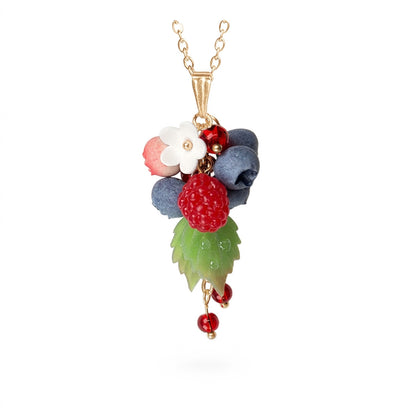 Berry necklace with handmade raspberry, blueberries, white flower and green leaf, gold chain necklace with red crystal details, handcrafted Finnish jewelry.