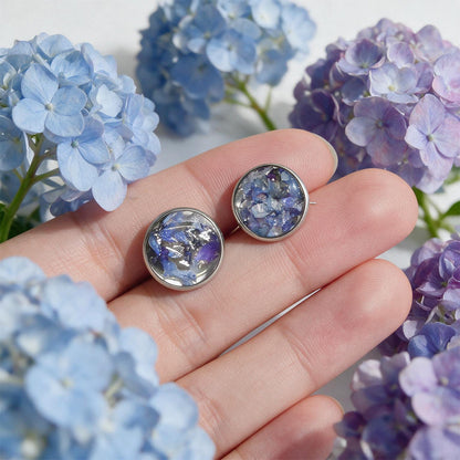 Hydrangea stud earrings with real hydrangea flowers preserved in resin, handcrafted in Finland with stainless steel posts.