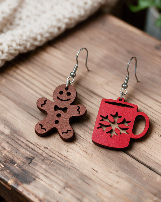 Gingerbread and Christmas mug earrings made in Finland, photographed on a wooden table in natural light