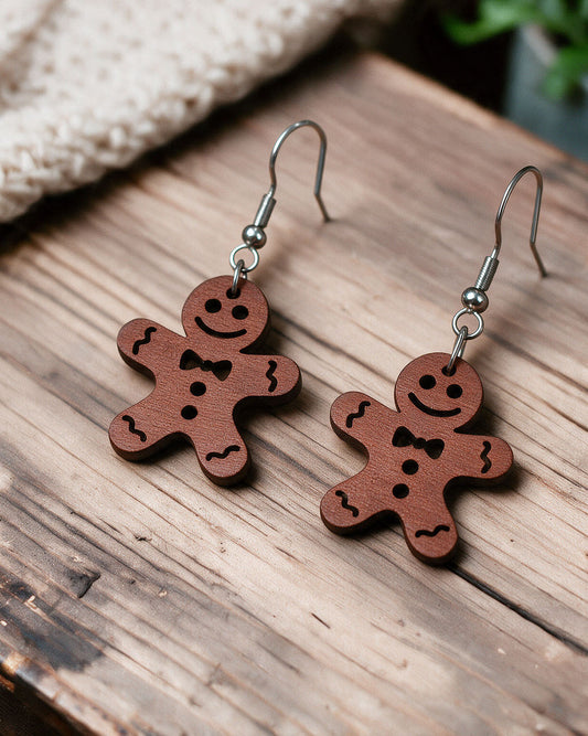 Gingerbread earrings made in Finland, photographed on a wooden table in natural light