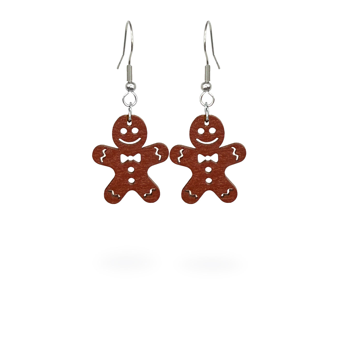 Gingerbread cookie earrings handmade from Finnish birch plywood, painted on both sides and inspired by traditional Christmas baking. Handmade in Finland by byMinta.