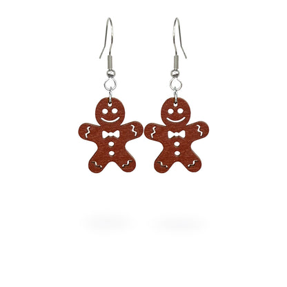 Gingerbread cookie earrings handmade from Finnish birch plywood, painted on both sides and inspired by traditional Christmas baking. Handmade in Finland by byMinta.