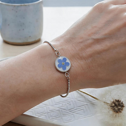 Handcrafted Forget-Me-Not Bracelet with real Forget-Me-Not flowers worn on a wrist