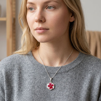 Woman wearing delicate verbena flower necklace with stainless steel chain and real flower pendant
