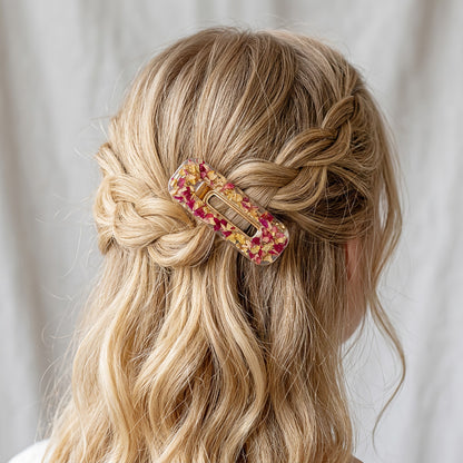 Handmade rose petal hair clip in braided blonde hairstyle