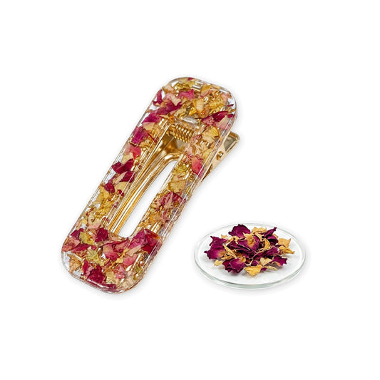 Rose hair clip with real rose petals and gold leaf on white background