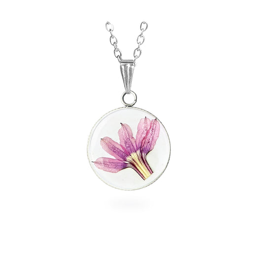 Handmade resin necklace with a real fan flower (Scaevola) preserved inside. Delicate botanical jewelry featuring a pressed pink fan flower on a white background and a stainless steel chain.