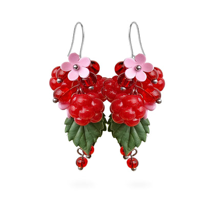 Raspberry Garden Earrings featuring hand-shaped raspberries, sparkling red crystal beads, pink flowers, and green leaves. Handmade in Finland by byMinta.