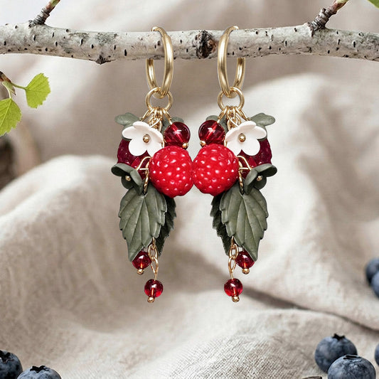 Red Wild Raspberry earrings handmade in Finland, featuring raspberries, white flowers, green leaves and red glass beads on gold plated huggie hoops