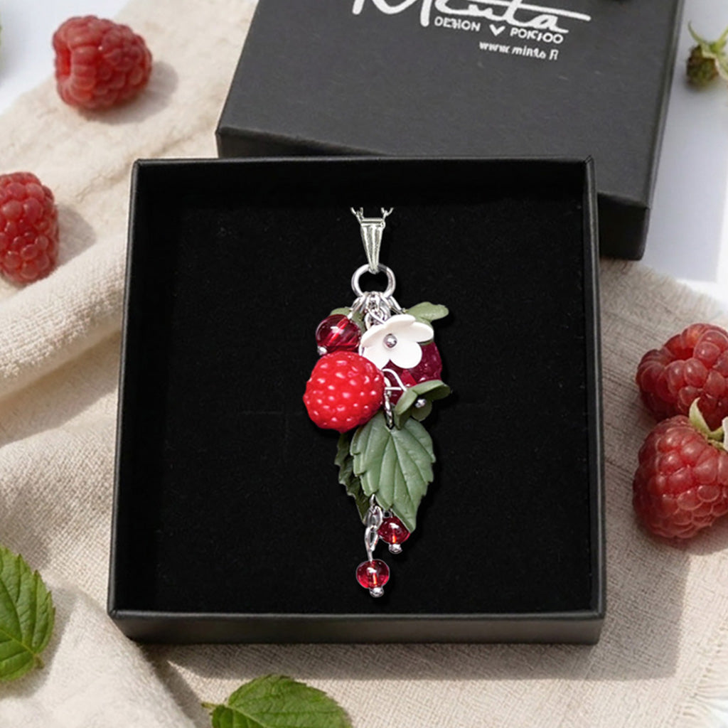 Wild Raspberry necklace presented in a gift box with fresh raspberries, raspberry leaves and natural linen. Handmade polymer clay berry jewelry inspired by Nordic nature, handcrafted in Finland by byMinta.