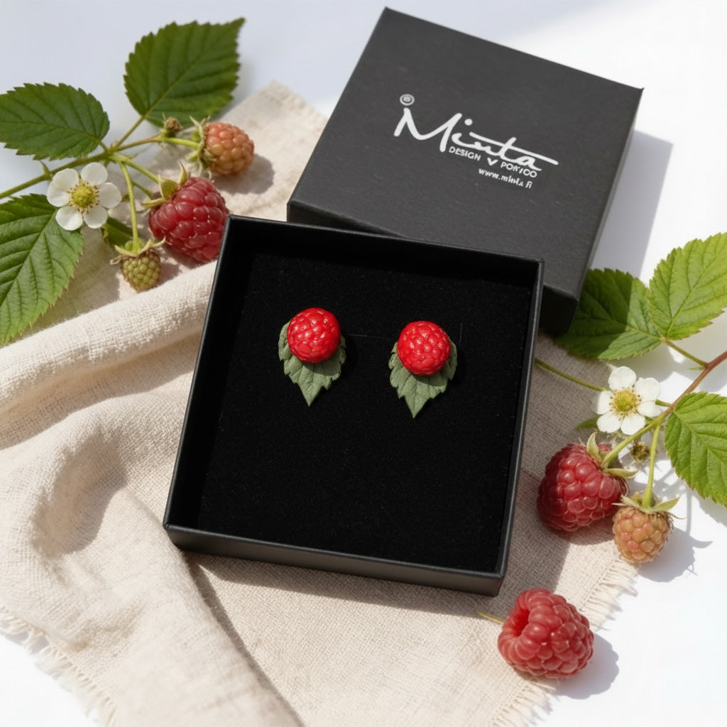 Wild Raspberry stud earrings presented in a gift box with fresh raspberries, raspberry leaves and natural linen. Handmade polymer clay berry jewelry handcrafted in Finland by byMinta.