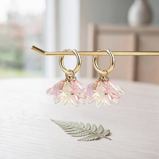 Handmade lampwork glass flower earrings in translucent pink and yellow with 18K gold-plated huggie hoops