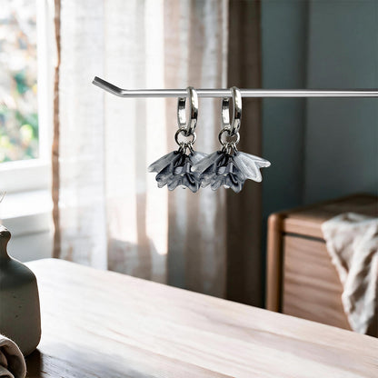 Floral Earrings – Smoke in stainless steel on a linen background